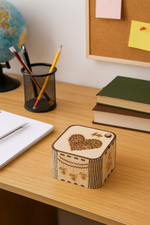 MDF box with heart design on a desk with stationery items