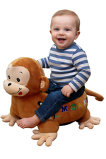 Child sitting on a monkey-shaped sofa seat with a white background
