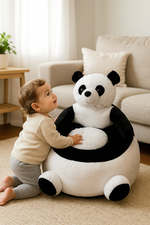 Child playing with a panda-shaped sofa seat in a living room.