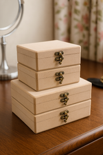 Stacked rectangular MDF lock boxes with vintage latch on a dresser
