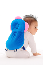 Baby wearing a blue head protector on a white background