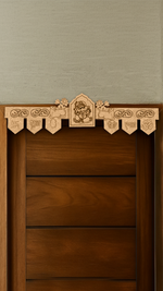 Lord Ganesha engraved MDF toran with Shubh Labh, Swastik, Kalash, and Om symbols – placed on wooden door frame in natural finish.