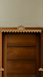 Laser-engraved MDF lotus toran with side hanging design – placed on wooden door frame in natural finish.