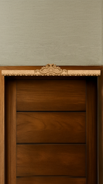 Intricately engraved MDF peacock toran with detailed borders – displayed on wooden door frame in natural finish