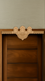 Three-arch mandala MDF toran with engraved centerpiece – displayed on wooden door frame in natural finish