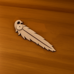 MDF feather-shaped incense holder on wooden surface
