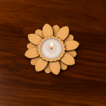 Decorative MDF daisy flower tealight holder with lit white candle in center, designed for Diwali or home decor use