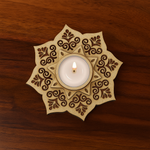 Laser‑cut 3‑layer MDF mandala‑style tea light holder on wooden surface, designed for tealight candles