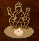 Laser-cut MDF Laxmiji silhouette tea-light candle holder with lit tealight on wooden surface