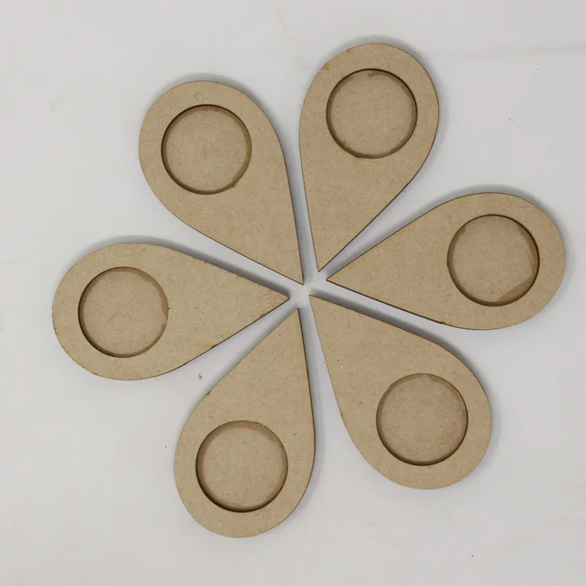 Set of six teardrop-shaped MDF DIY tea light holder bases arranged in a floral pattern for craft and festive décor projects
