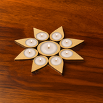 Leaf-shaped MDF tea light holder without candles on wooden surface