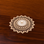 Designer flower 3-layer MDF tealight holder with intricate cut floral design placed on wooden surface