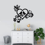 Romantic heart-shaped wall art with bird silhouettes and intricate floral designs, mounted above a white dresser in a modern room.