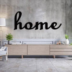 Home wall art in black finish displayed on a textured concrete wall above a modern light wood console, enhancing cozy home decor.