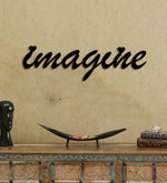 Imagine wall art in black finish mounted on a textured beige wall above a rustic console table, adding creative inspiration to the home decor.