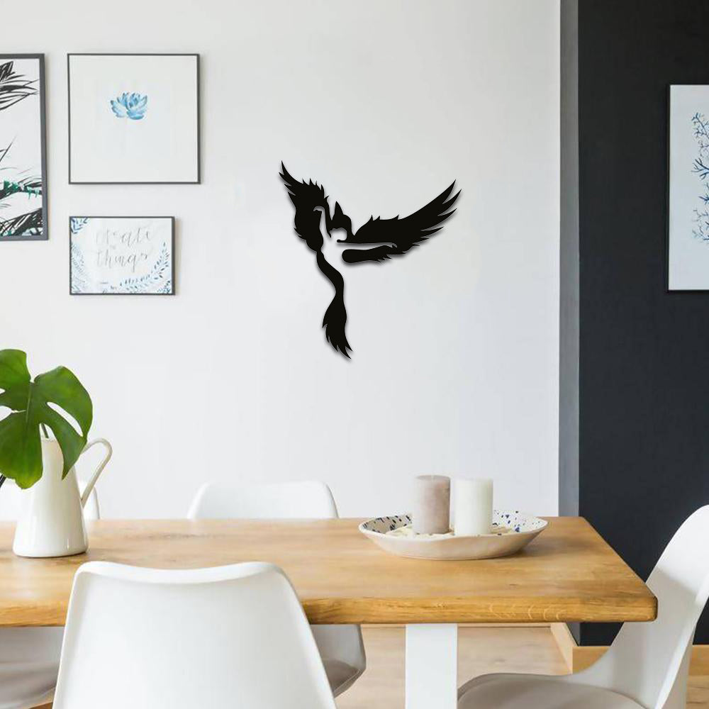 Black MDF wall art showcasing a girl transforming into a bird, symbolizing freedom, mounted on a dining room wall.