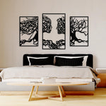 Black MDF tree wall decor featuring a stunning three-panel design with intricate branches forming abstract faces, mounted on a bedroom wall above a modern bed.