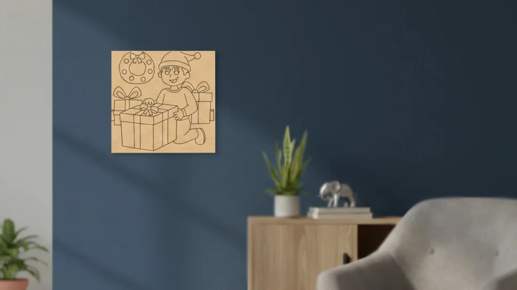 Wooden MDF Christmas wall art featuring a child with gift boxes and festive decorations displayed on a modern blue living room wall.
