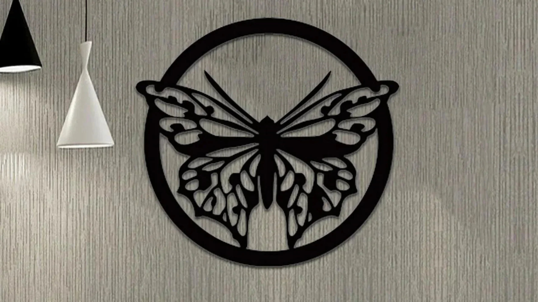 Black butterfly MDF wall art with intricate laser-cut detailing inside a circular frame, mounted on a textured beige wall, creating a modern and elegant home décor aesthetic.