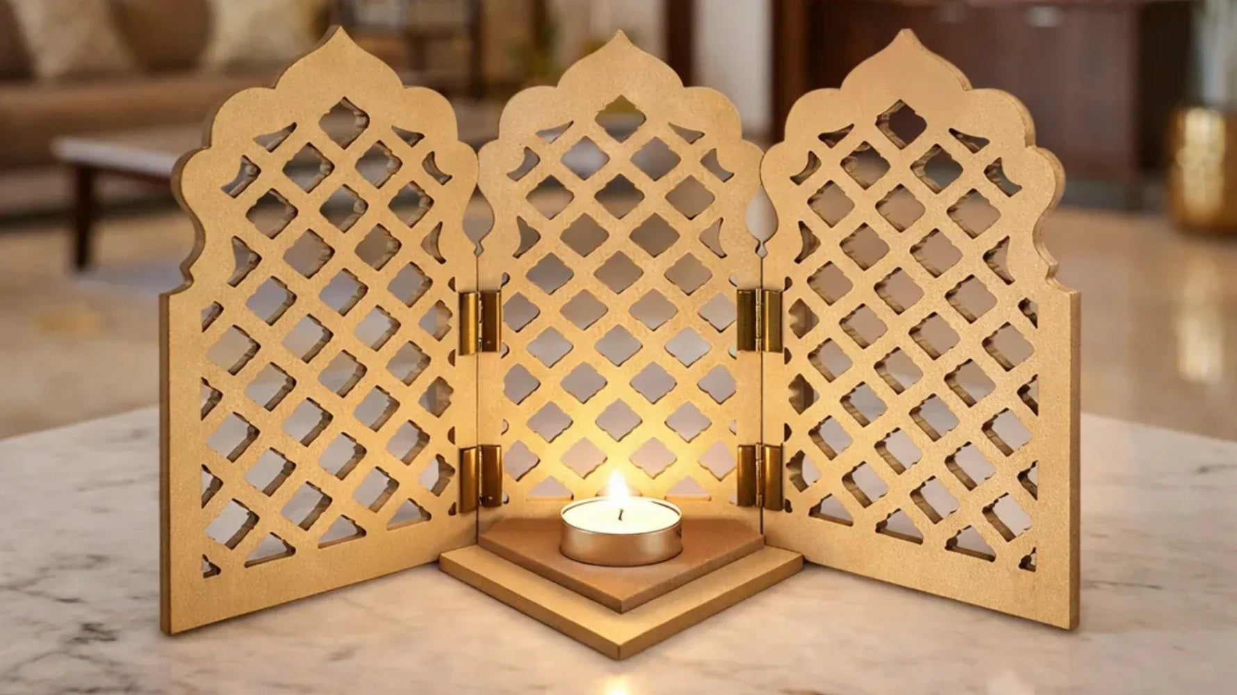 MDF tealight holder with three decorative lattice panels and a glowing candle, displayed on a marble surface in a warm home interior.