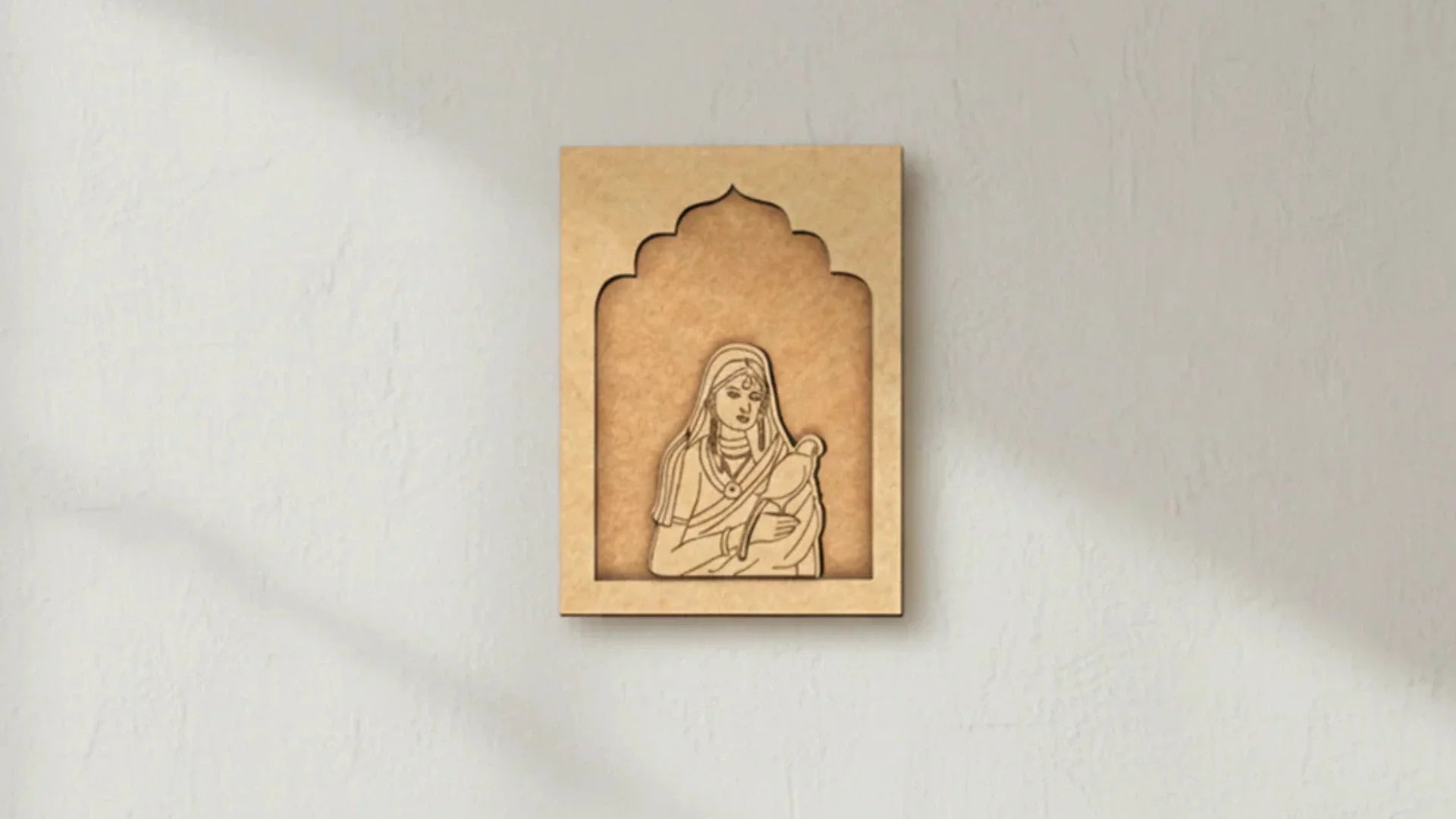 MDF mother and child wall art hanging on a light textured wall in a minimalist home interior.