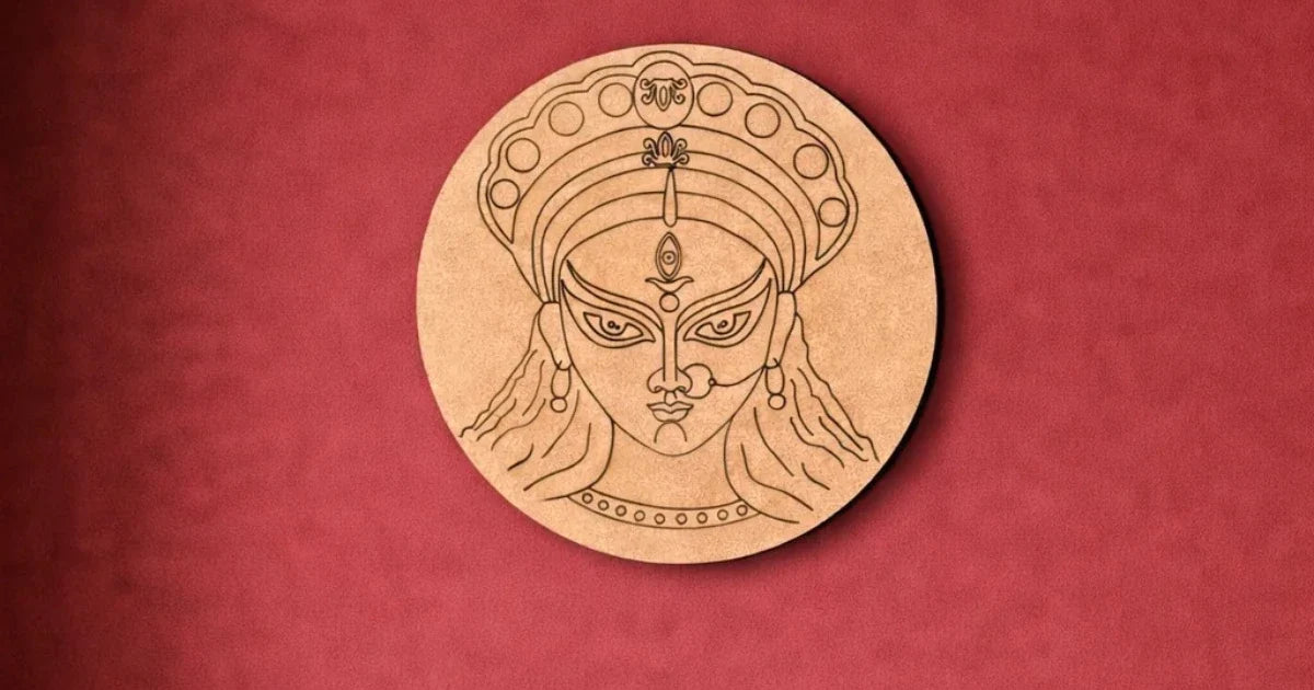 Round MDF craft base featuring an engraved Goddess Durga face design on a red background.