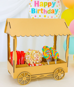 Unpainted MDF candy cart with colorful lollipops and marshmallows, used for kids birthday party