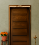 Intricately engraved MDF peacock toran with detailed borders – displayed on wooden door frame in natural finish