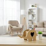 MDF elephant pen holder with colored pencils on wooden table in cozy living room