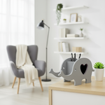 Grey elephant desk organizer with black pens in minimalist study room