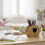MDF elephant pencil holder on kids’ study table with open books and stationery
