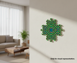 Decorative wall art with green and blue pattern on a wall in a living room.