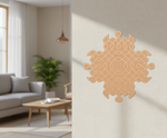 Decorative MDF DIY wall art on a neutral wall with a living room in the background