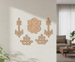 Decorative MDF DIY wall art pieces on a neutral wall with a living room in the background