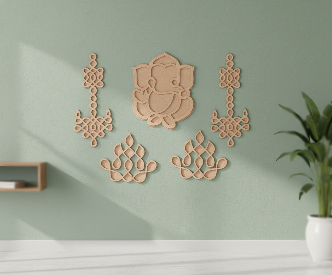 Decorative MDF DIY wall art pieces on a light green wall with a plant in the corner.