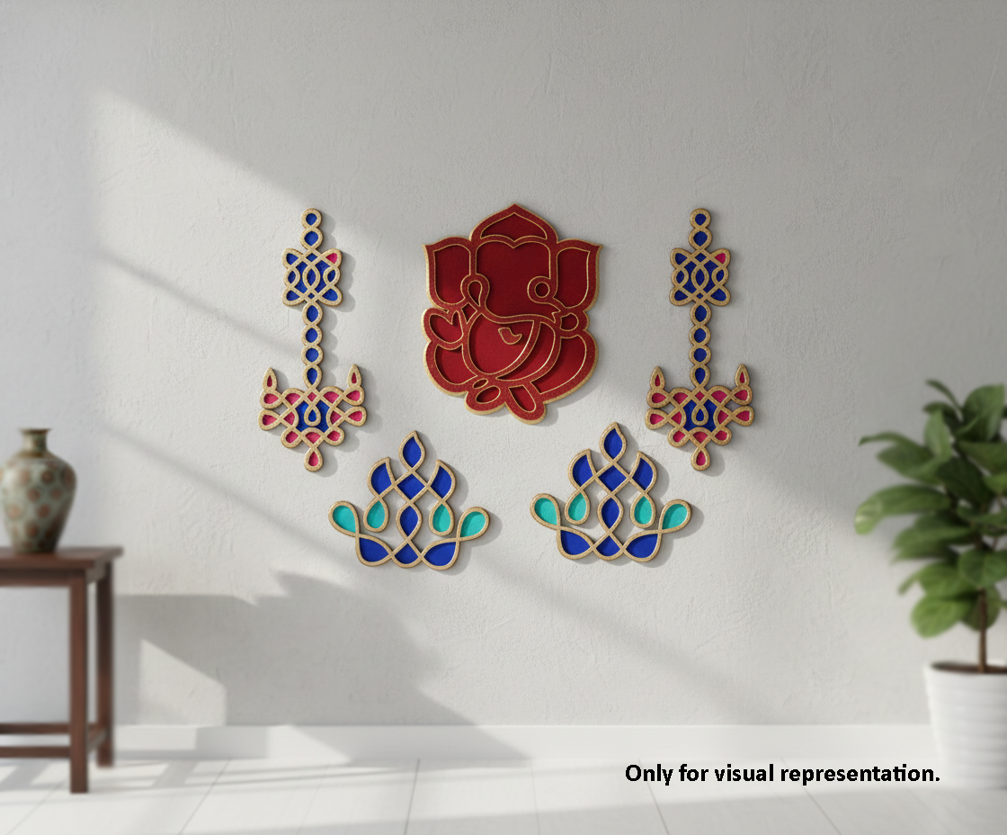 Decorative MDF DIY wall art pieces on a white wall with a plant and table in the background.