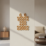 Decorative  MDF DIY wall piece on a neutral wall with furniture in the background