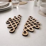 Two decorative MDF DIY wall art with intricate patterns on a light gray surface.