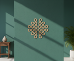 Decorative MDF DIY wall piece on a teal wall with a wooden side table and plant in the background