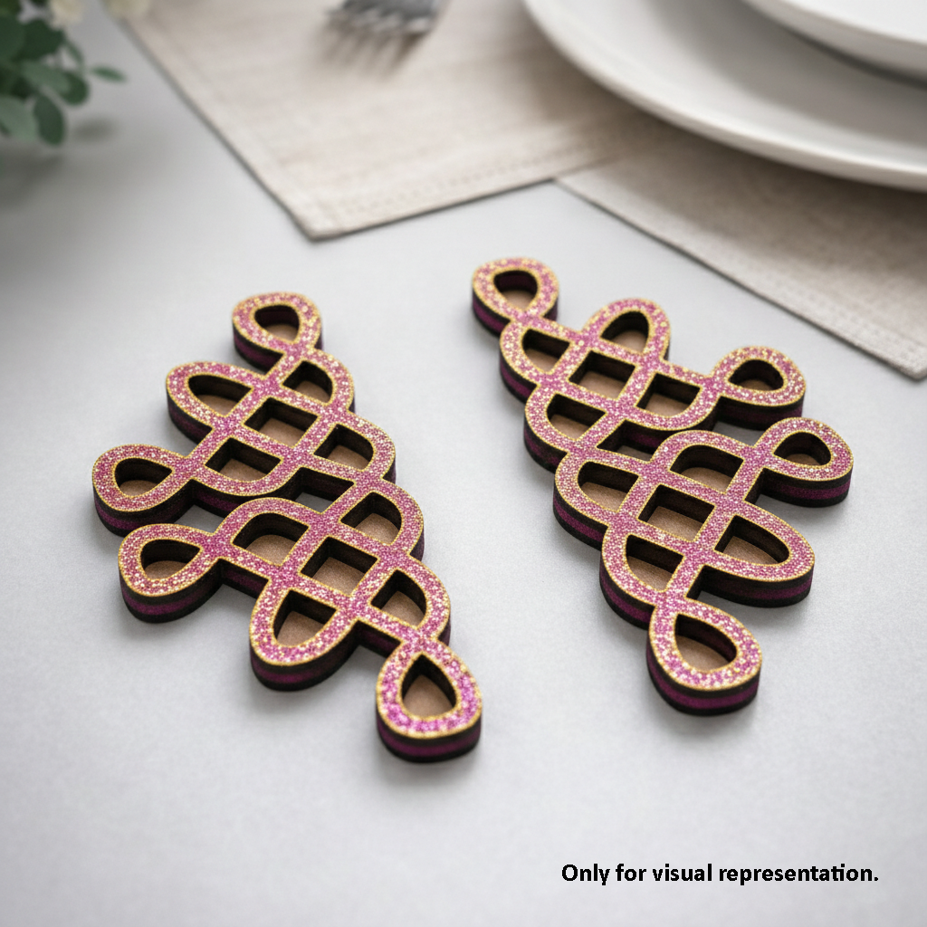 Decorative pink and black MDF DIY kolam art on a light surface with a neutral background