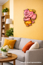 MDF DIY Wall art of a pink ganesh character on a yellow wall above a gray sofa with colorful cushions.