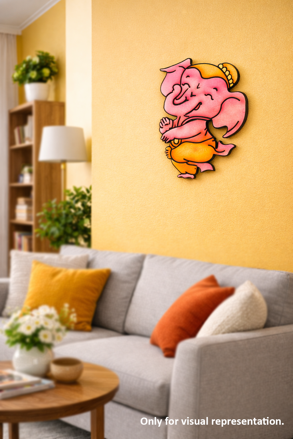 MDF DIY Wall art of a pink ganesh character on a yellow wall above a gray sofa with colorful cushions.