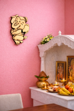 Decorative MDF DIY wall piece of a cartoon character on a pink wall.