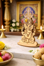 MDF DIY  Ganesha statue on a marble surface with flowers and candles in the background 