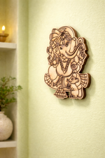 MDF DIY wall decor of a deity figure on a light green wall.