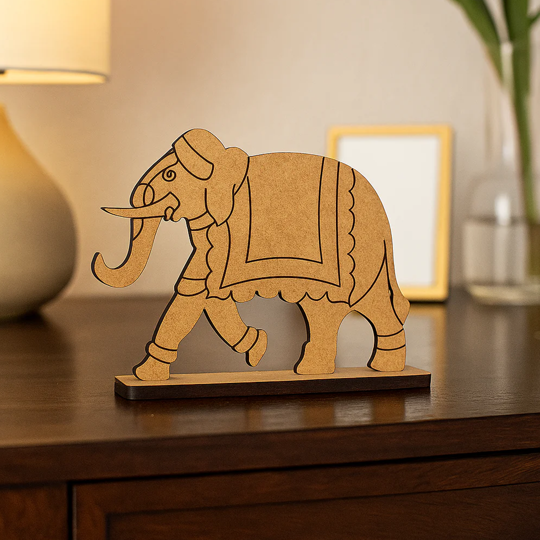 DIY MDF elephant figurine on a wooden surface with a blurred background
