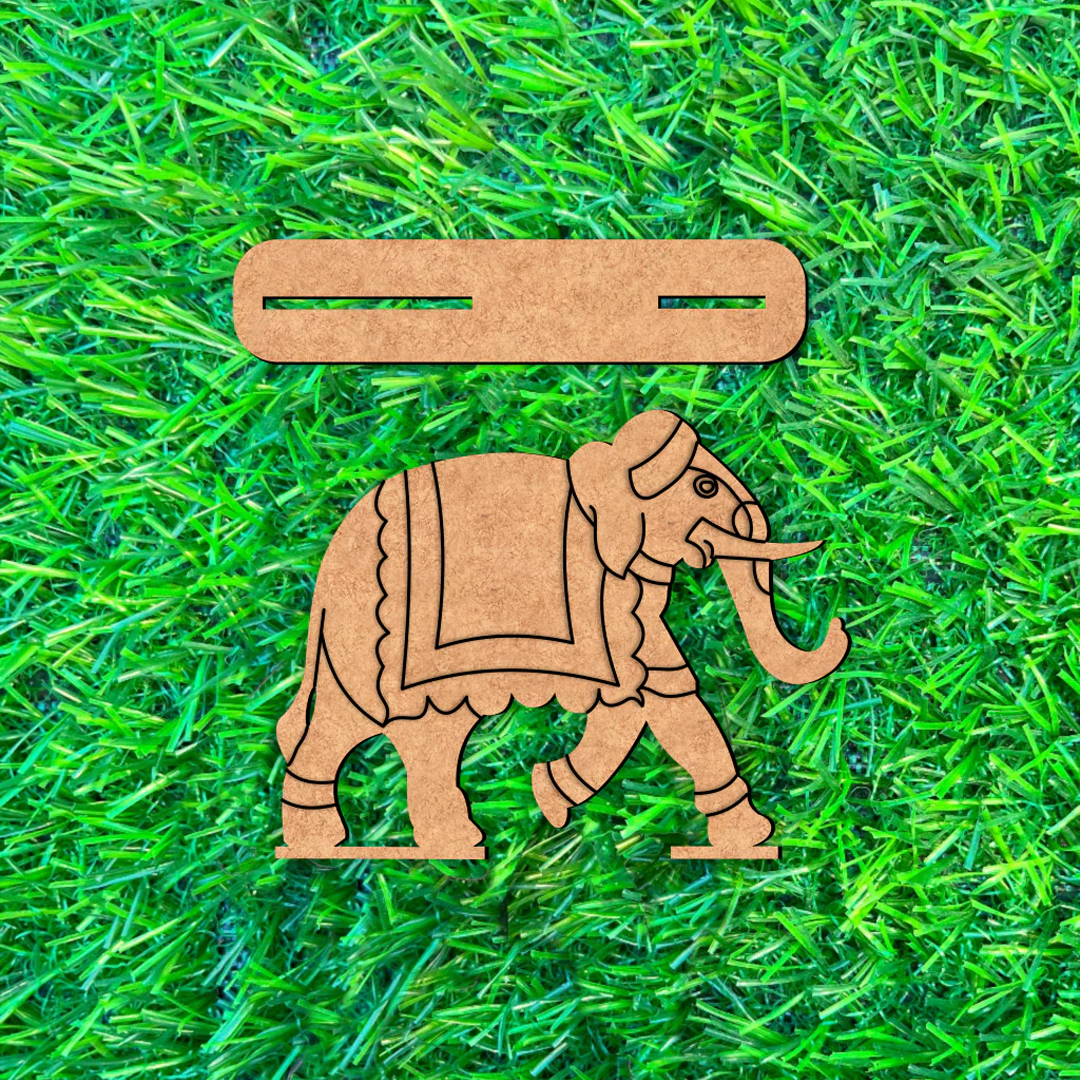 DIY MDF  elephant and belt on a grassy background