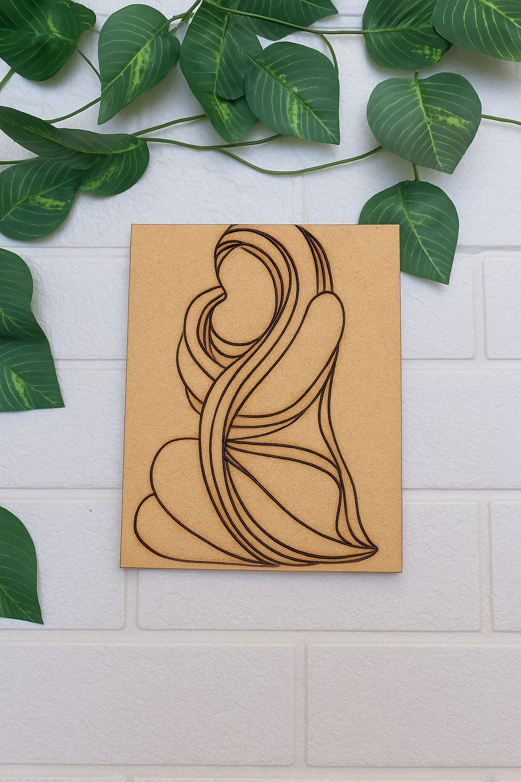 Unpainted MDF board with laser-etched outline of a traditional mother and child painting – ready for DIY art