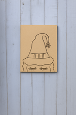 DIY traditional painting of a witch hat with spider and closed eyelashes on MDF board