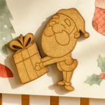 DIY MDF Santa Claus cutout holding gift for Christmas craft and wall decor